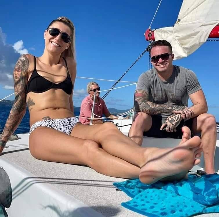 Tiffany Nicole Buck and Jon Thomas Buck relaxing together on a sailboat in St. Croix